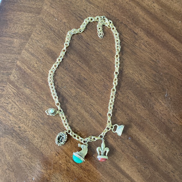 Gold tone charm necklace. Adjustable length. Great condition. - Picture 2 of 10